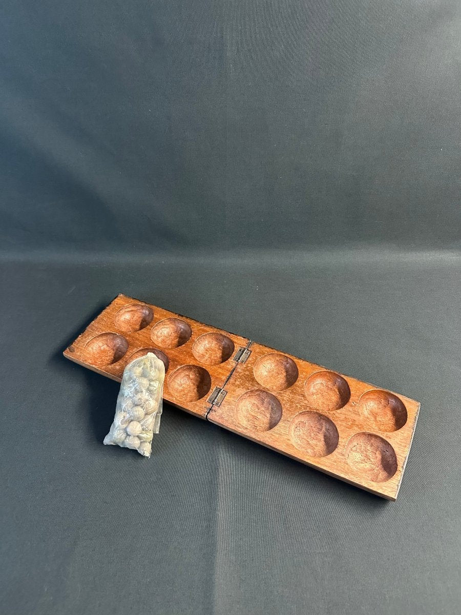 Jeu africain Awalé en bois à motif végétal -