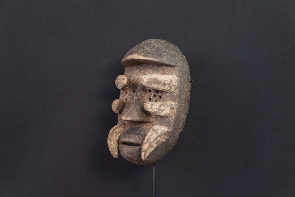 Masque Igbo initiatique circulaire aux cornes recourbées -