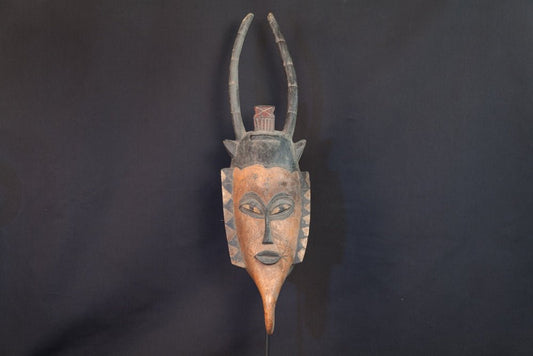 Masque Gouro en bois à coiffe verticale et cornes - 